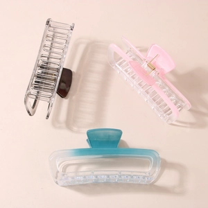Three gradient geometric rectangular hair claws in gray, pink, and blue colors