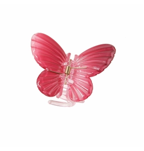 Close-up of pink butterfly hair claw clip with golden metal spring and textured resin wings