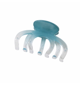Macro detail of a large gradient blue shark hair claw clip with a multi-tooth design