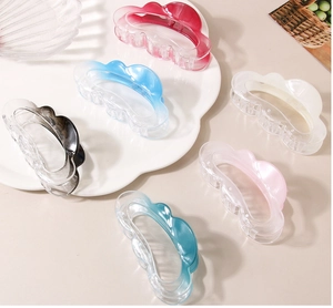 Set of 6 colorful cloud-shaped wave hair claws in acrylic resin on a white tray
