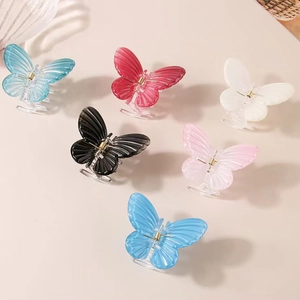 Set of 6 colorful butterfly hair claws in translucent resin with realistic textures