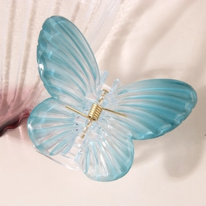 Elegant butterfly hair claw with blue-green gradient and textured double-layer wings