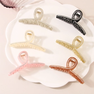 Dettaglio di set da 6 fermagli per capelli in resina con strass in vari colori pastello