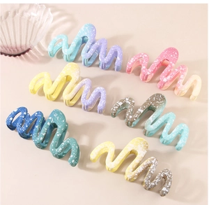 Detailed set of wavy hair claws with matte gradient colors and white ink splash texture