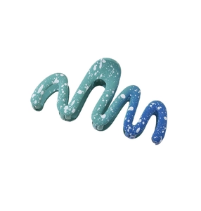 Detail showing the gradient teal to navy blue wavy claw clip with matte splatter finish