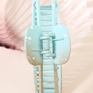 Geometric gradient blue hair claw clip with splash ink pattern for elegant hair styling