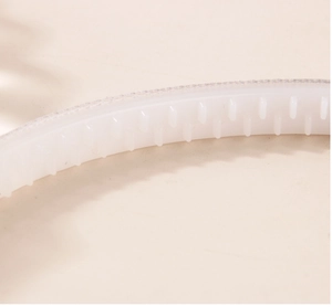 Detail view of 1cm non-slip plastic headband with inner teeth and silver woven fabric trim