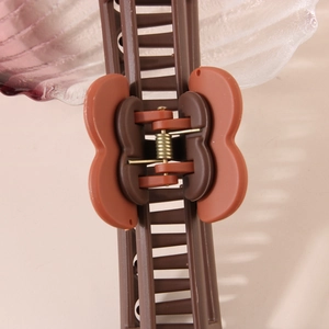 Brown and brick red heart-shaped large hair claw clip with matte finish and strong spring