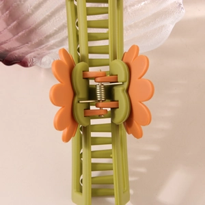 Frosted rectangular daisy hair claw clip in green and orange for elegant hair styling