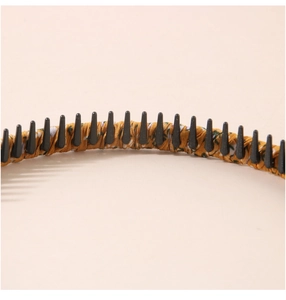 Detail of floral fabric headband with non-slip black inner teeth for secure hair grip