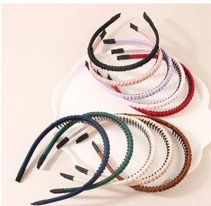 Close-up of woven fabric headbands featuring internal non-slip teeth in various colors