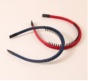 Detail of red and navy blue non-slip satin headbands with protective fabric tips