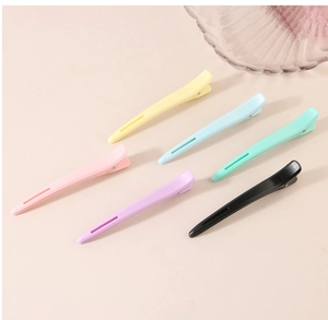 Detailed view of matte macaron duckbill clips in six colors for hairstyling hair sectioning