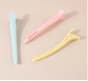 Macro view of long matte macaron duckbill hair clips with durable metal springs