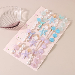 5-piece ocean theme hair clip set featuring starfish and seashell designs for girls