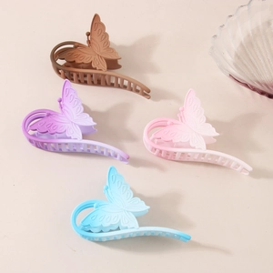 Elegant gradient butterfly hair claws in four pastel colors with matte resin finish