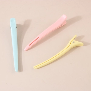 Large macaron colored sectioning hair clips for styling in blue, pink, and yellow