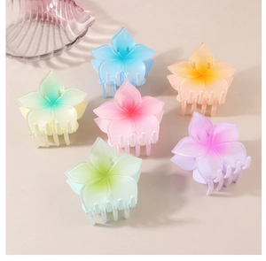 Detailed set of six colorful matte plumeria flower hair claws for summer beach styling