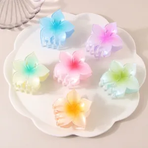 Elegant frangipani hair claw clips set in various gradient colors for women