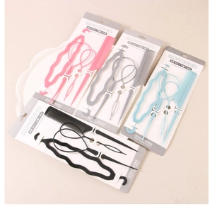 Close-up of invisible hair tool set in pink, grey, blue, and black colors