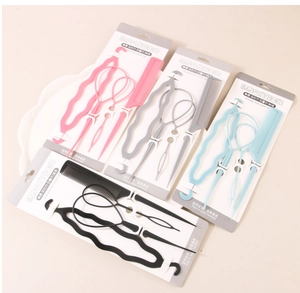 Detail view of 4-piece hair styling set including topsy tail tools and comb in various colors