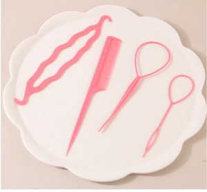 Detailed view of pink 4-piece hair styling set including hair loops and a tail comb