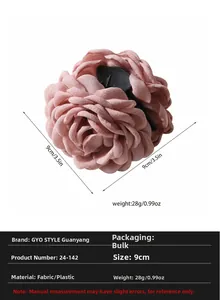 Detail showing pink fabric flower hair claw clip measuring 9cm with multi-layer petals