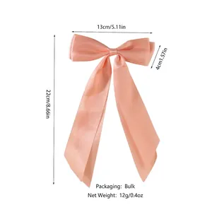 Elegant apricot pink double-layer satin bow hair clip with long ribbon streamers