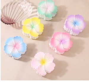 Set of six colorful gradient flower hair claws with matte finish and Hawaiian style