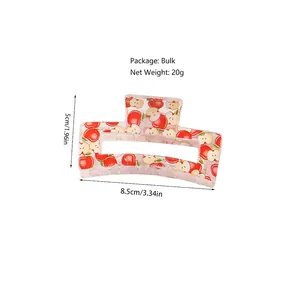 Medium 8.5cm square hair claw clip in transparent plastic with red apple polka dot pattern