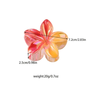 Floral plumeria claw clip with orange gradient finish and iridescent pearlescent texture