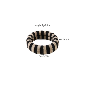 Detailed view of black and beige striped knitted hair tie with 4cm diameter dimensions