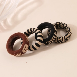 Set of four vintage knitted elastic hair ties with patterns and Smile text motifs
