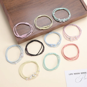 10-piece set of woven elastic hair ties with pearls and beads in various pastel colors
