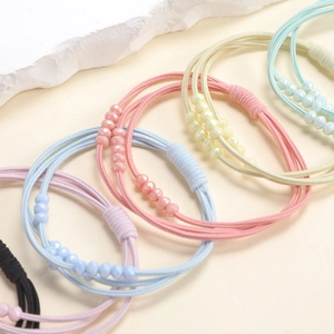 Elastic braided hair ties with pearl beads in pastel colors for ponytails