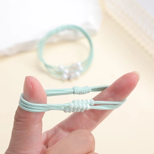 Elastic mint green hair scrunchie with faceted beads for versatile ponytail styles
