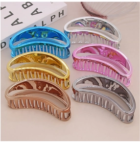 Detailed close-up of set of six metallic large hair claw clips in various plating colors