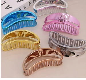 Detail showing six colors of metallic semi-circular hair claw clips with mirror finish