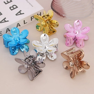 Set di sei mollette per capelli a forma di fiore in finiture metalliche oro argento blu