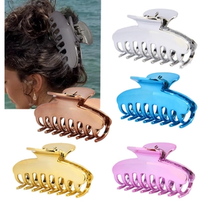 Detail view of large metal shark hair clips in glossy silver, gold and rose gold finishes