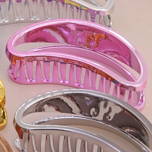 Polished electroplated metallic shark hair claw clips in pink and silver semi-circle design