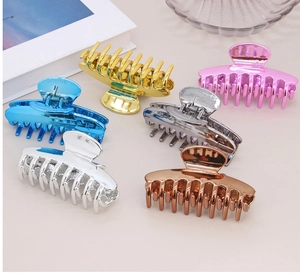 Detailed set of 6 metallic finish large hair claws in gold pink and blue colors
