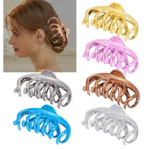 Detail showing five metallic hair claw clips in gold, pink, bronze, silver and blue shades