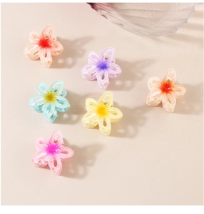 Set of six gradient resin flower hair claws in multiple colors with golden metal springs