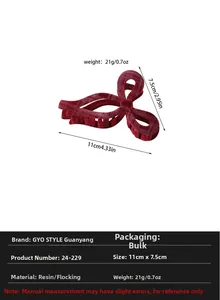 Detailed view of 11cm dark red flocked bow hair claw clip with size and weight info