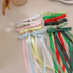 Set of colorful long ribbon bow hair clips in various elegant silk satin shades