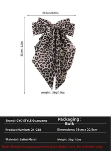 Detail of leopard print satin bow hair clip with dimensions 33cm x 20.5cm and spring clip