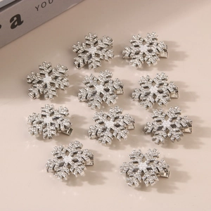 Set of 10 silver snowflake hair clips with shimmering rhinestones and faux pearls