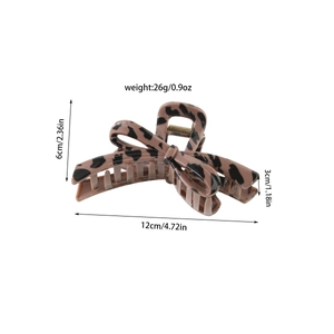 Detail showing dimensions of leopard print hair claw clip with bow design and metal spring