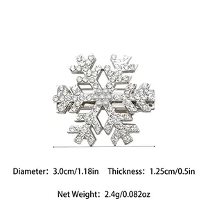 Sparkling snowflake hair clip with rhinestones and faux pearl details, silver metal finish
